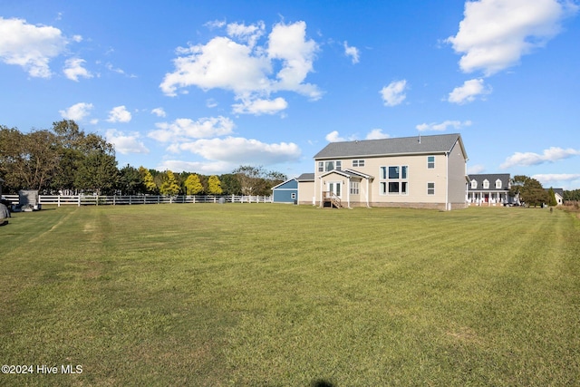 view of yard with a rural view