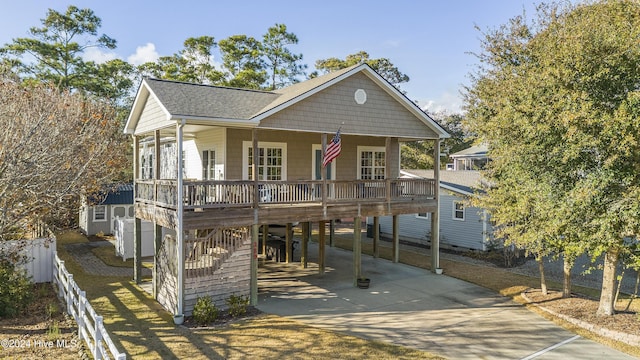 view of front facade with a porch and a carport