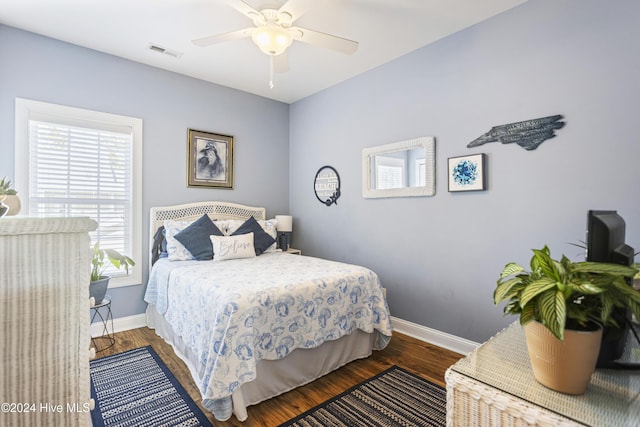 bedroom featuring ceiling fan and dark hardwood / wood-style flooring