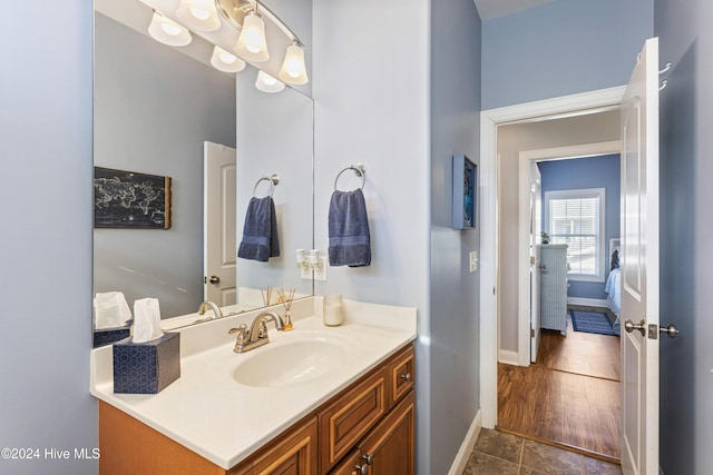 bathroom featuring hardwood / wood-style floors and vanity