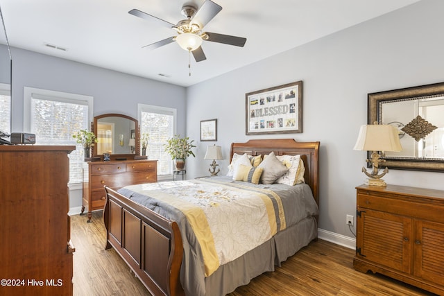 bedroom with hardwood / wood-style floors and ceiling fan