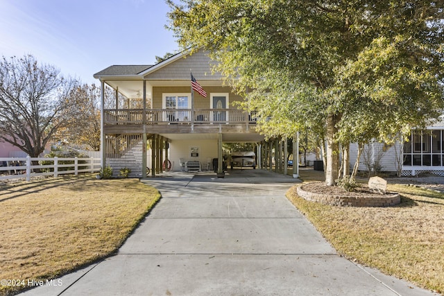 view of front facade with covered porch and a carport