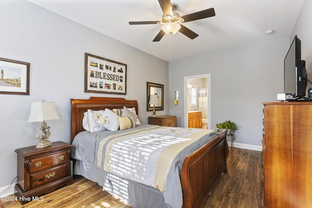 bedroom with ceiling fan, dark wood-type flooring, and connected bathroom