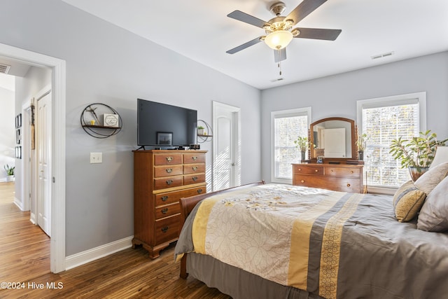 bedroom featuring ceiling fan and dark wood-type flooring