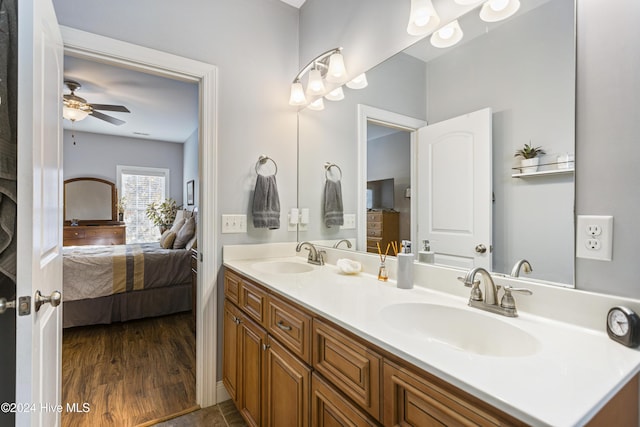 bathroom with ceiling fan, hardwood / wood-style floors, and vanity