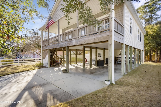 view of patio featuring a carport and a wooden deck