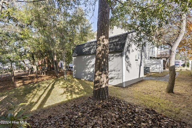 view of side of home featuring a yard