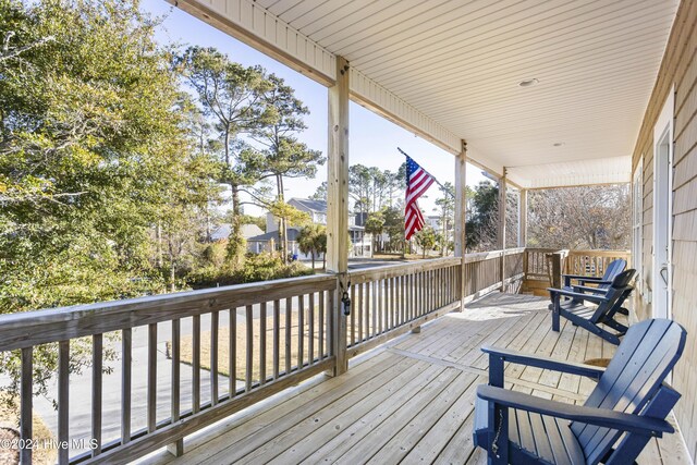 wooden terrace with a porch