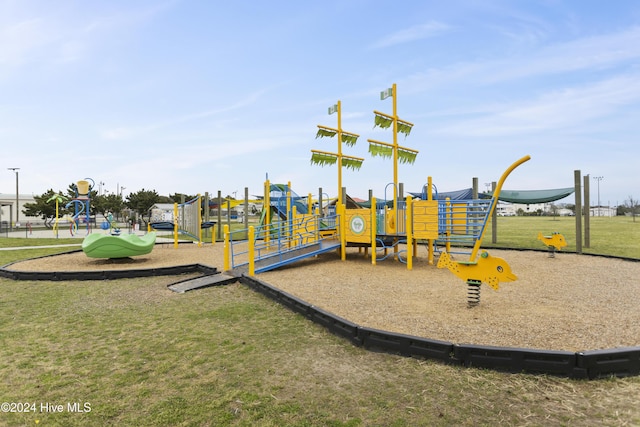 view of play area featuring a lawn