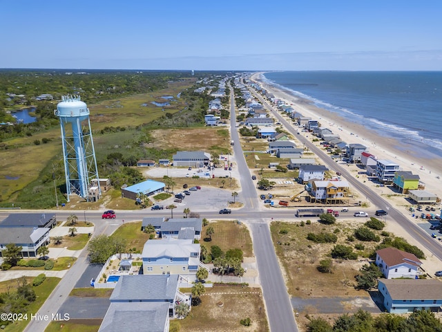 drone / aerial view with a water view and a view of the beach