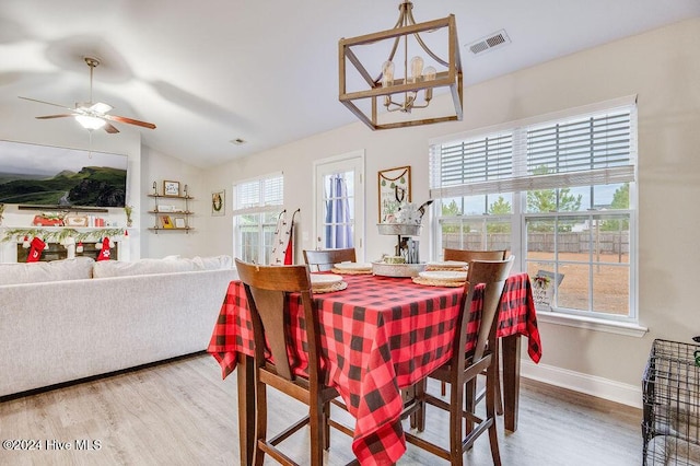 dining room with wood-type flooring and a wealth of natural light