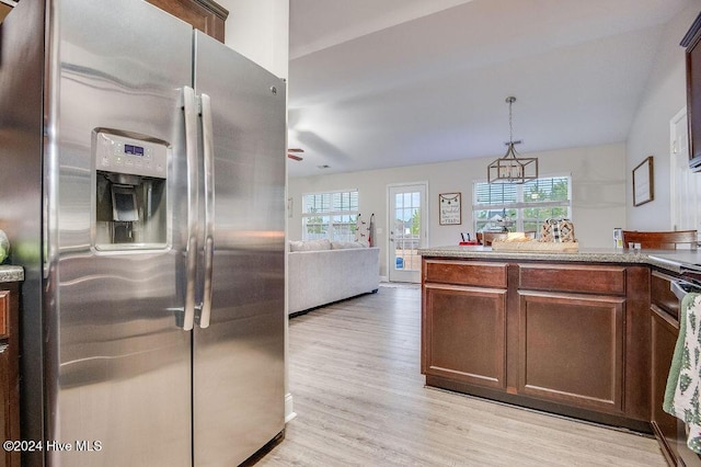 kitchen featuring decorative light fixtures, light hardwood / wood-style floors, stainless steel fridge with ice dispenser, and ceiling fan