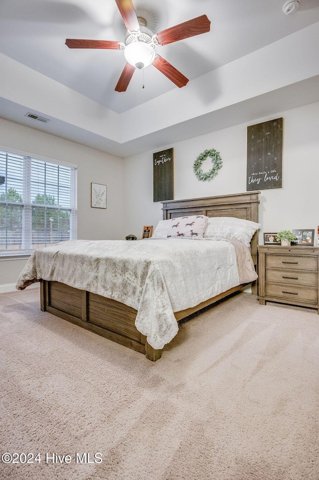 carpeted bedroom featuring ceiling fan