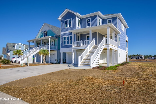 view of front of home featuring a porch and a garage