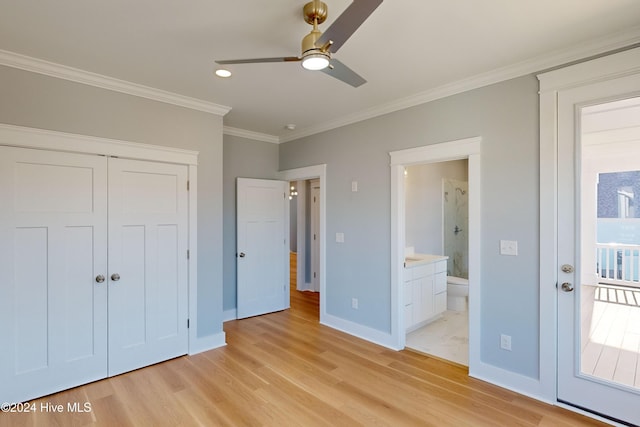 unfurnished bedroom featuring ornamental molding, ceiling fan, connected bathroom, light hardwood / wood-style floors, and a closet