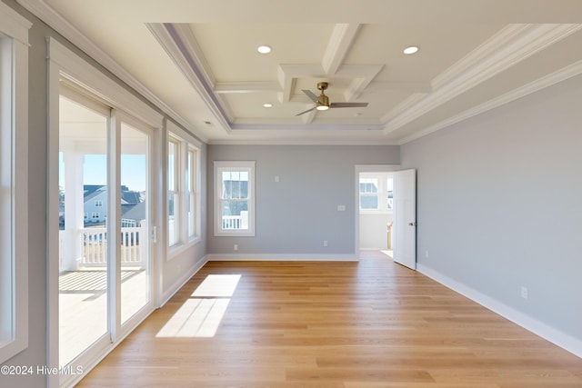 unfurnished room featuring a wealth of natural light, light hardwood / wood-style flooring, ceiling fan, and ornamental molding