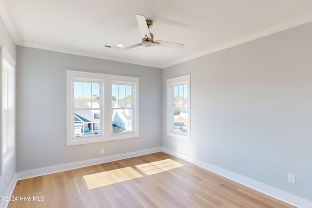 empty room with crown molding, ceiling fan, and light hardwood / wood-style floors