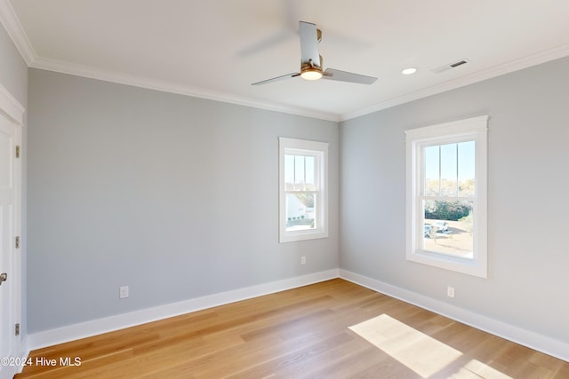 empty room featuring light wood-type flooring, ceiling fan, and ornamental molding