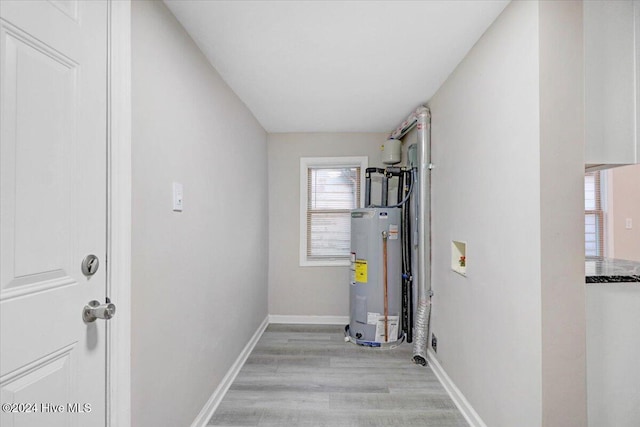 utility room featuring electric water heater