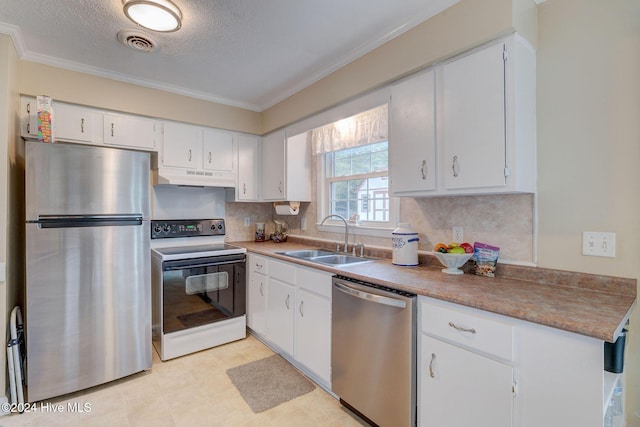 kitchen with white cabinets, sink, stainless steel appliances, and a textured ceiling