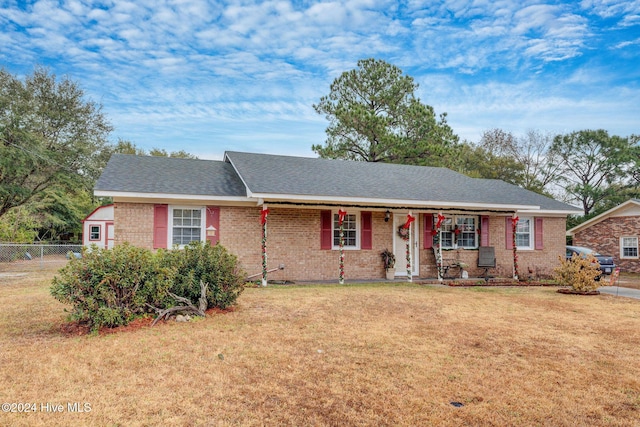 ranch-style house with a front lawn