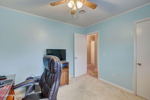 carpeted office featuring a textured ceiling, ceiling fan, and crown molding