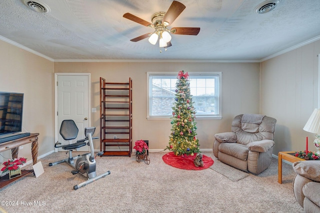 interior space featuring carpet floors, ceiling fan, and crown molding