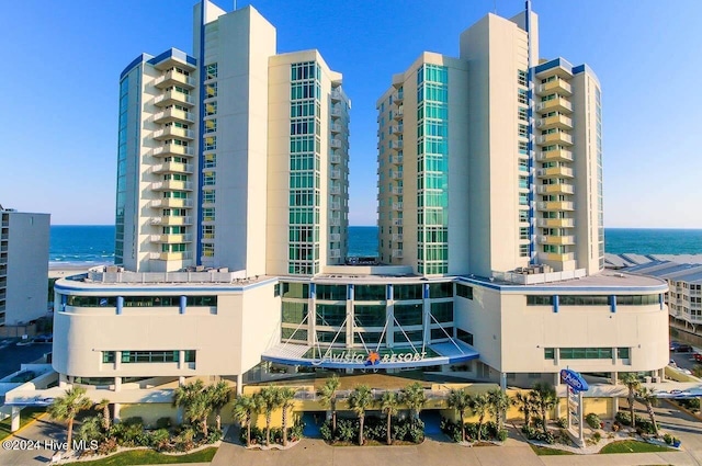 view of building exterior with a water view