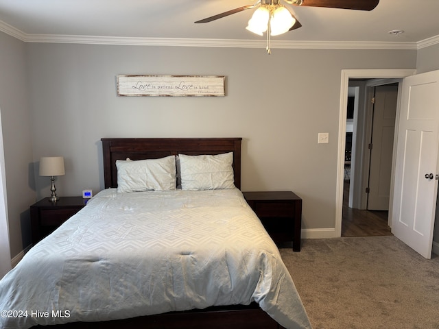 carpeted bedroom featuring ceiling fan, crown molding, and baseboards