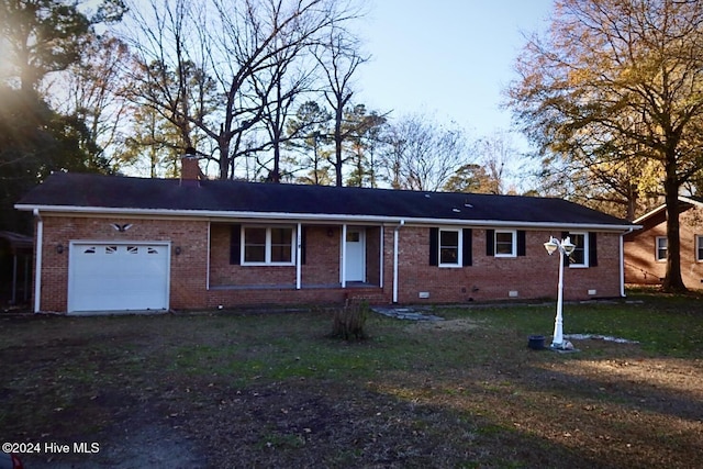 ranch-style house featuring a garage