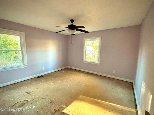 unfurnished room with ceiling fan