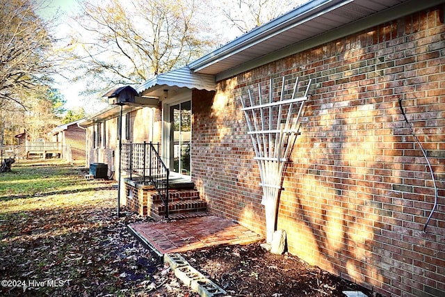 view of side of home featuring central air condition unit