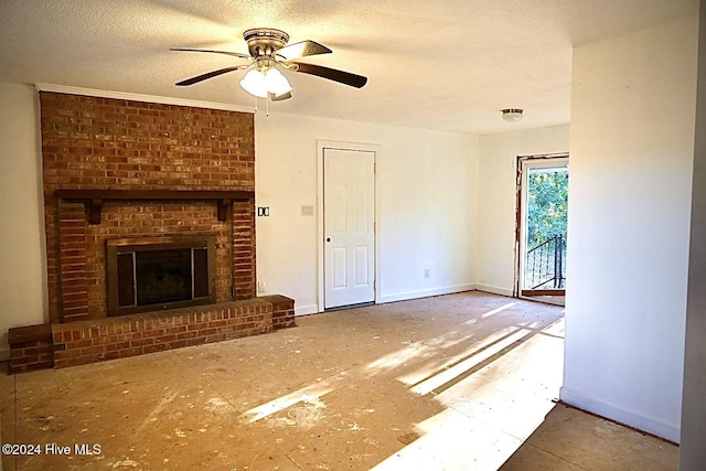 unfurnished living room featuring ceiling fan, a textured ceiling, and a fireplace