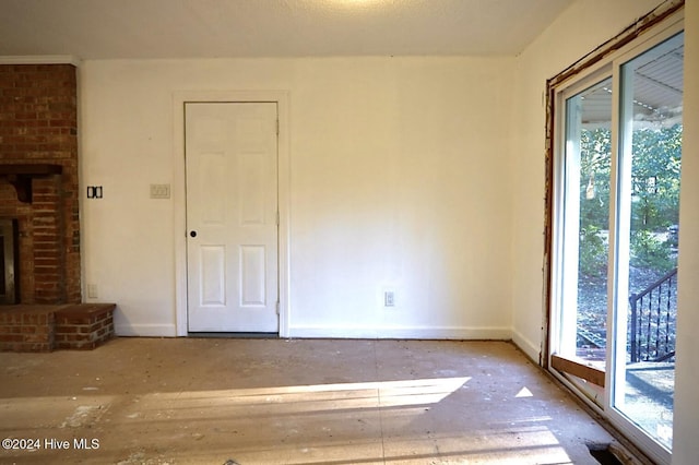 interior space with a wealth of natural light and a fireplace