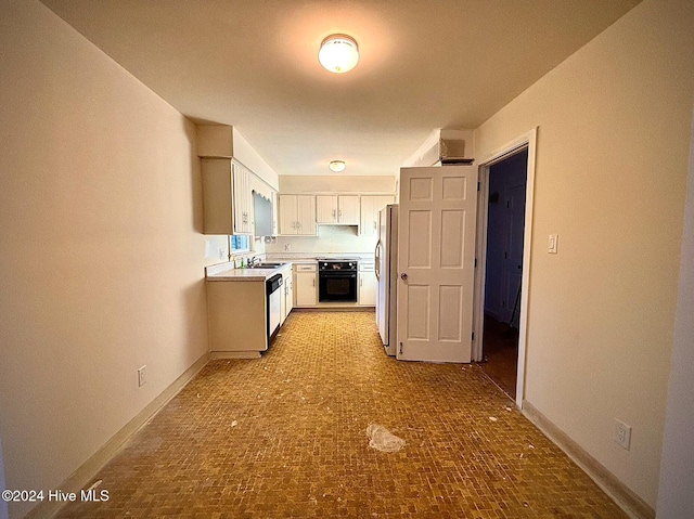 kitchen featuring sink, refrigerator, dishwasher, black range with electric cooktop, and white cabinets