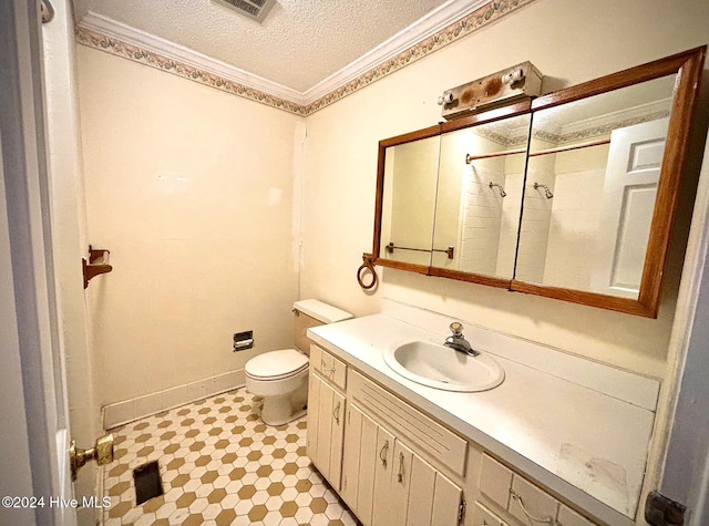 bathroom featuring walk in shower, toilet, crown molding, a textured ceiling, and vanity