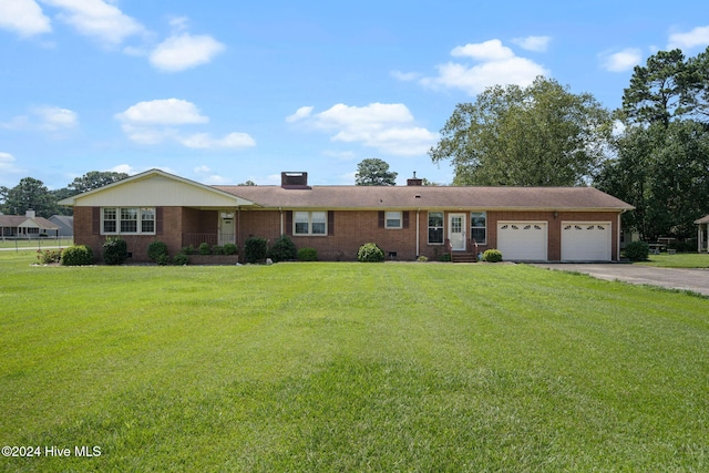 ranch-style house featuring a garage and a front yard