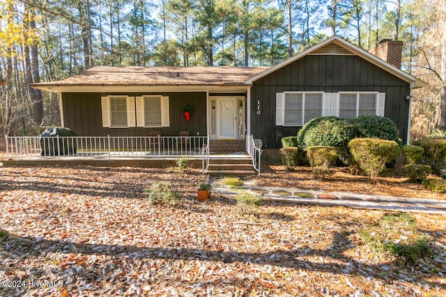 single story home with covered porch