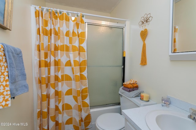 full bathroom with combined bath / shower with glass door, vanity, and toilet