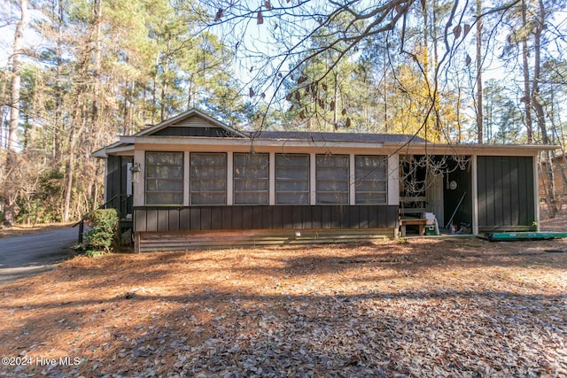 view of front of home with a sunroom