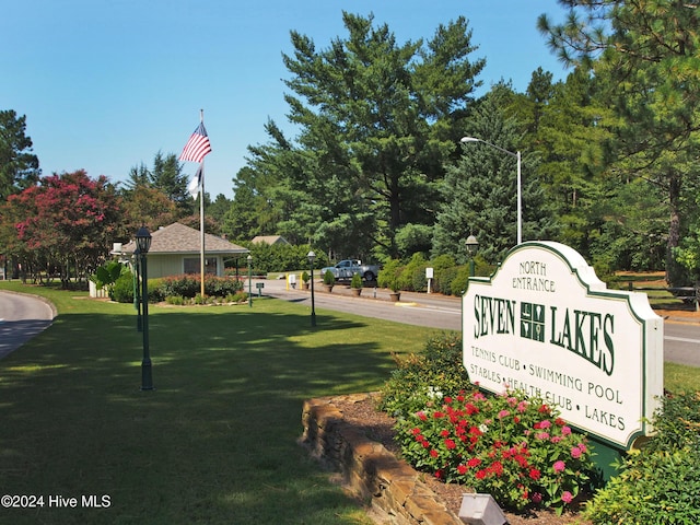 surrounding community featuring a yard