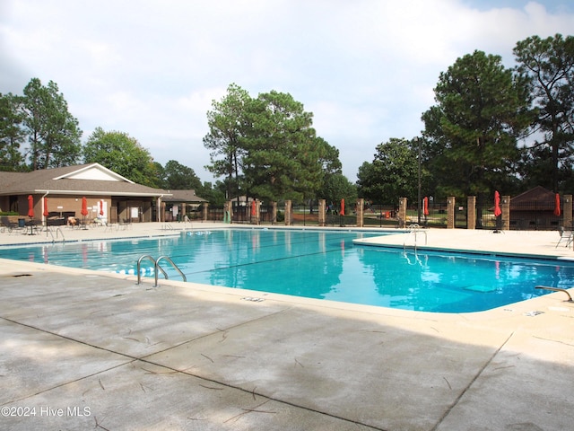 view of swimming pool with a patio area