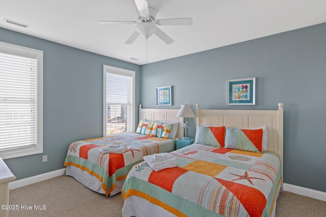 bedroom with ceiling fan and carpet floors