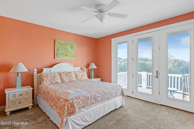 carpeted bedroom featuring access to exterior and ceiling fan