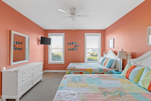 bedroom featuring ceiling fan and light carpet