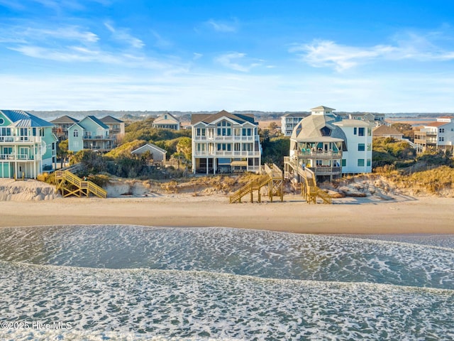 birds eye view of property featuring a beach view