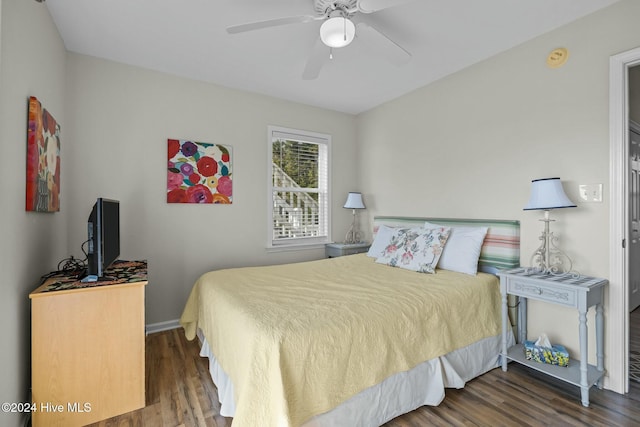 bedroom featuring ceiling fan and dark hardwood / wood-style floors