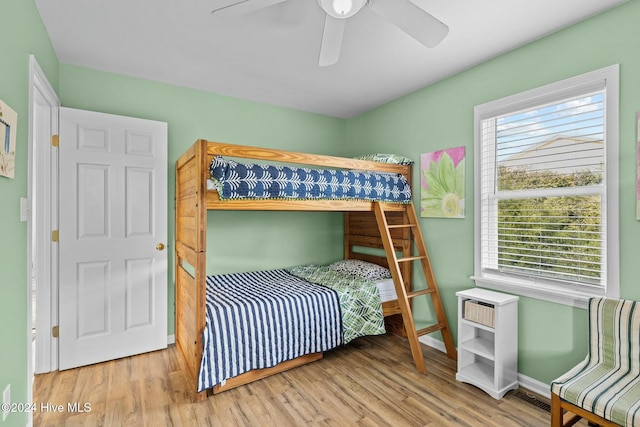 bedroom with ceiling fan and light hardwood / wood-style floors