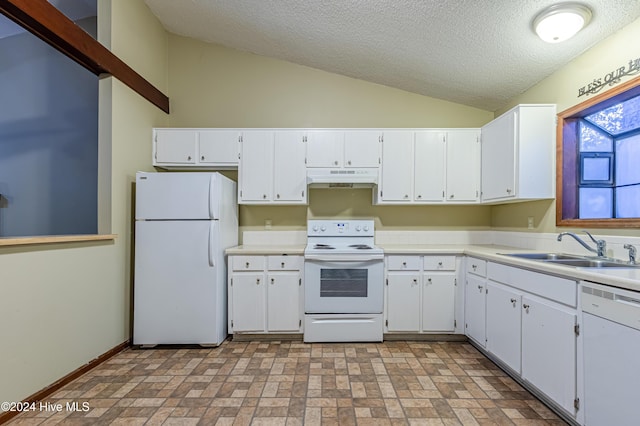 kitchen featuring a textured ceiling, white appliances, sink, white cabinets, and lofted ceiling