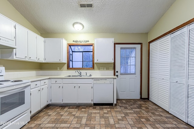 kitchen featuring a textured ceiling, white appliances, exhaust hood, sink, and white cabinetry